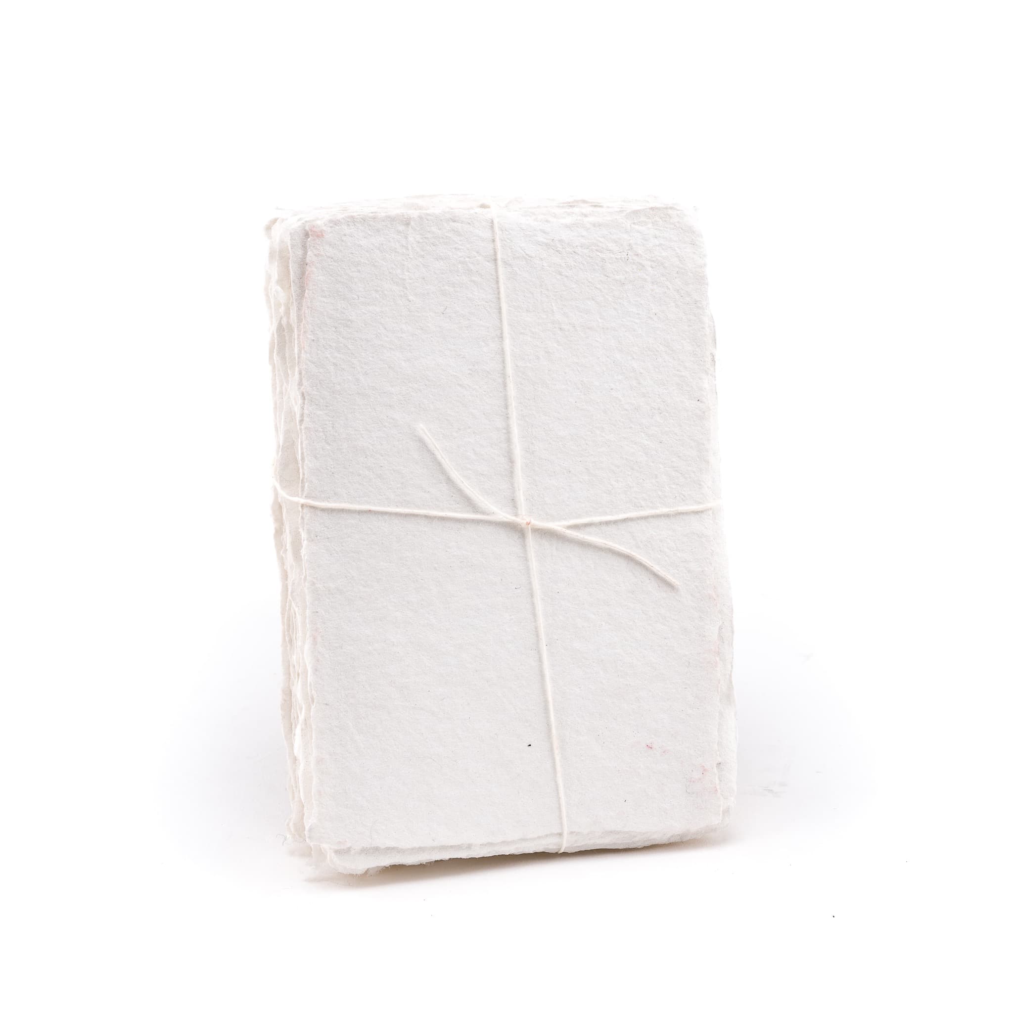 Pack of white shimmering handmade paper made with 100% cotton recycled from the apparel industry.