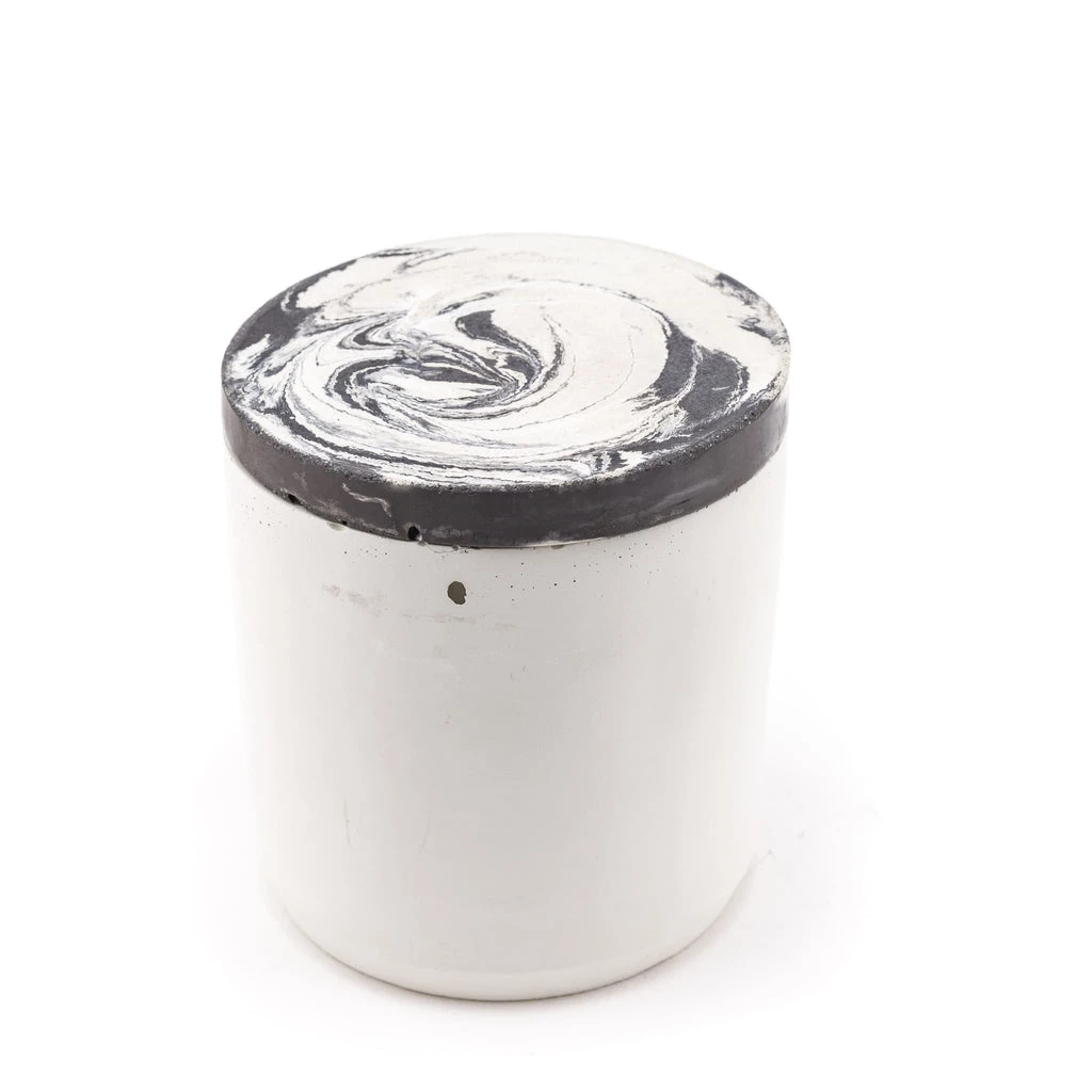 100% soy handpoured candle in a handmade swirled concrete jar. lemon, wild rose, bergamot scents