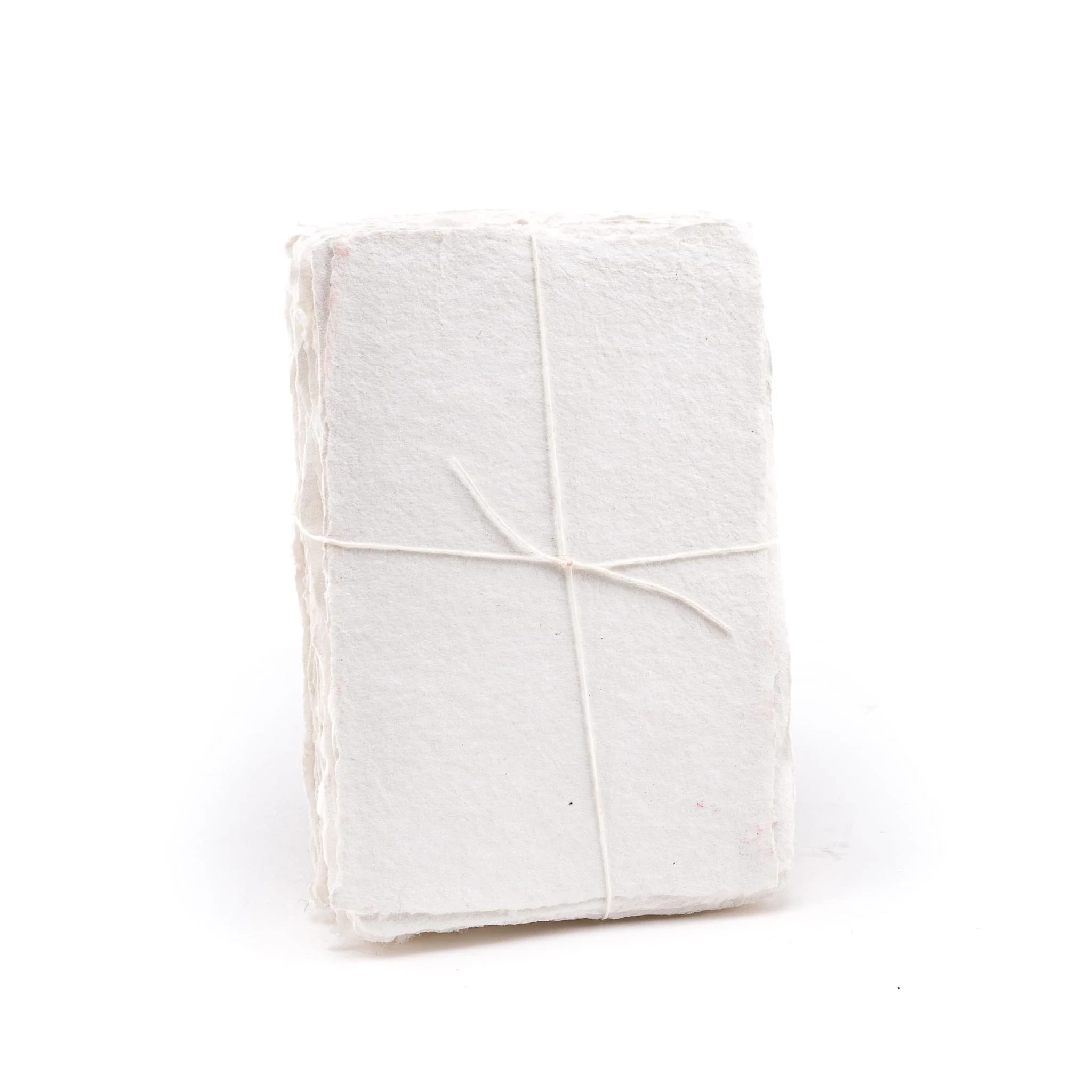 Pack of white shimmering handmade paper made with 100% cotton recycled from the apparel industry.