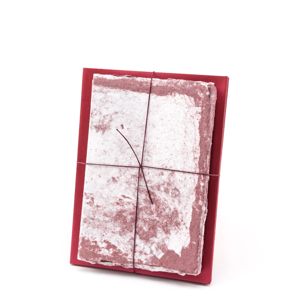 Speckled cotton handmade paper stationery set in swirled red and white with matching envelopes.